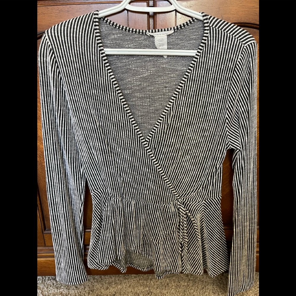 Caution to the wind. V-neck crossover. Long sleeve. Never worn. Size large.